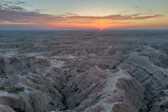 Sunrise in the Badlands with a big horn sheep in the bottom left Sunrise in the Badlands with a big horn sheep in the bottom left
